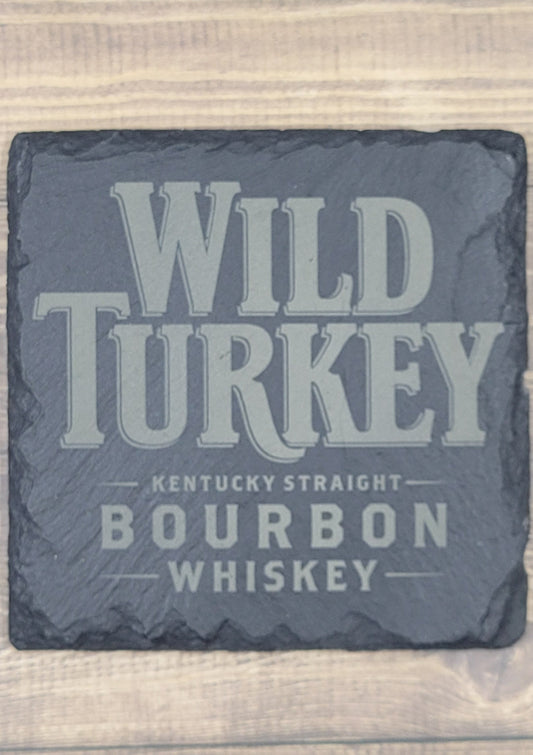 Wild Turkey Bourbon Whiskey Natural Slate Coaster  These slate coasters will make a great addition to anyplace from your bar to your coffee table. These are actual stone slate measuring approximately 4" x 4". Each coaster will have 4 foam padded feet.