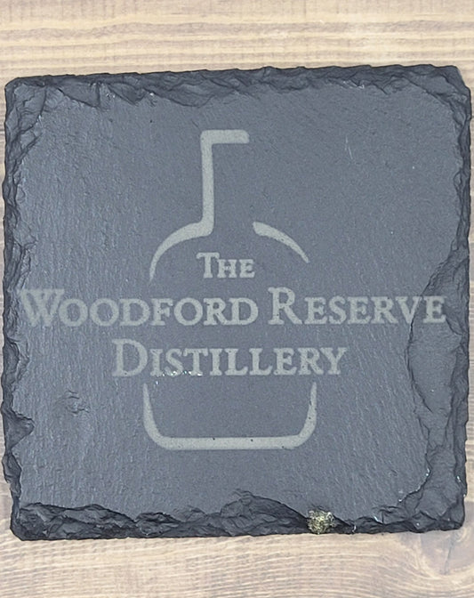 Woodford Reserve Distillery Natural Slate Coaster  These slate coasters will make a great addition to anyplace from your bar to your coffee table. These are actual stone slate measuring approximately 4" x 4". Each coaster will have 4 foam padded feet