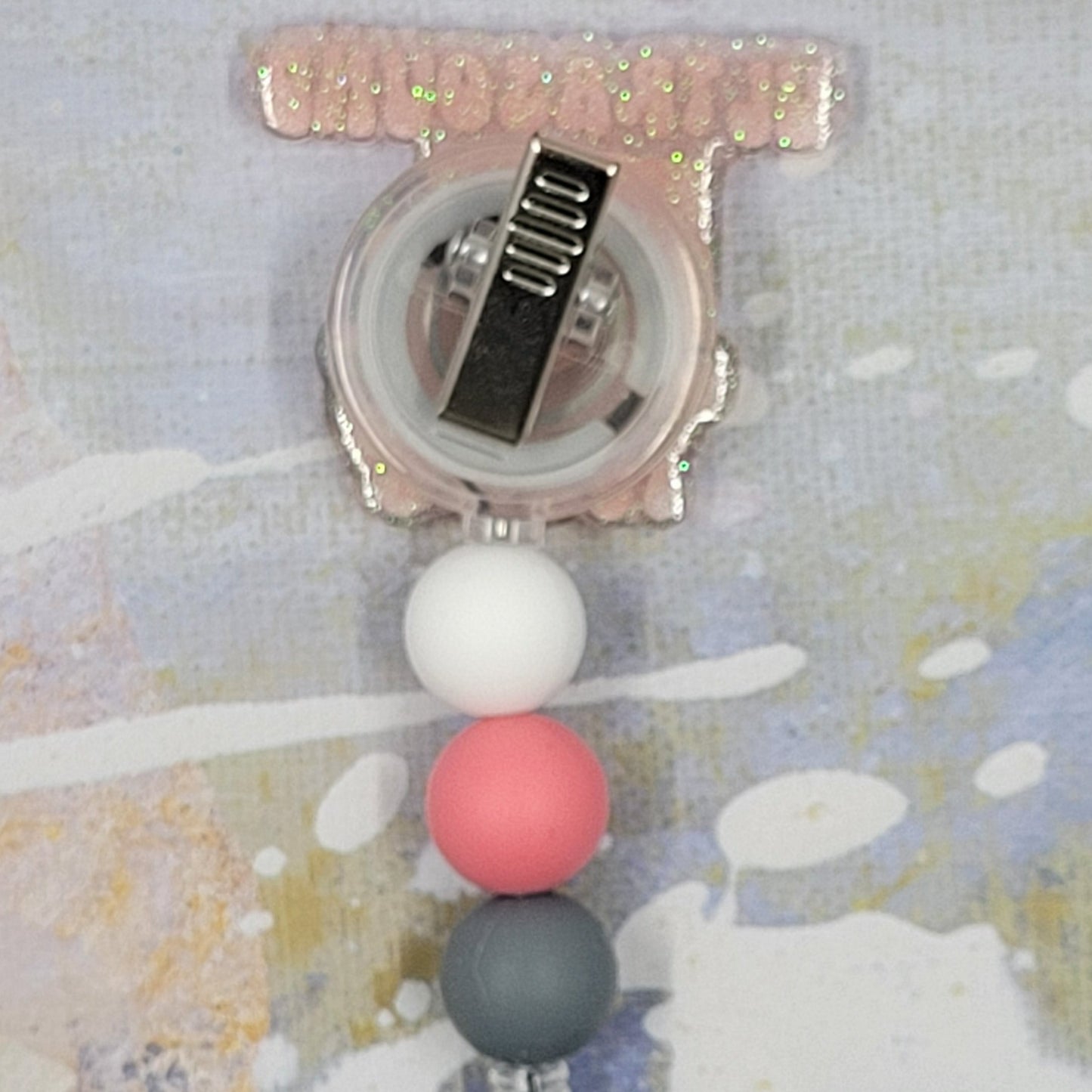 Introducing the new Ultrasound Tech Badge Reel, part of our latest collection of Medical Badge Reels available now. Featuring Ultrasound Tech in pink lettering and an ultrasound machine over a clears glitter base finished with coordinating beads, this Badge Reel is sure to catch the eye.