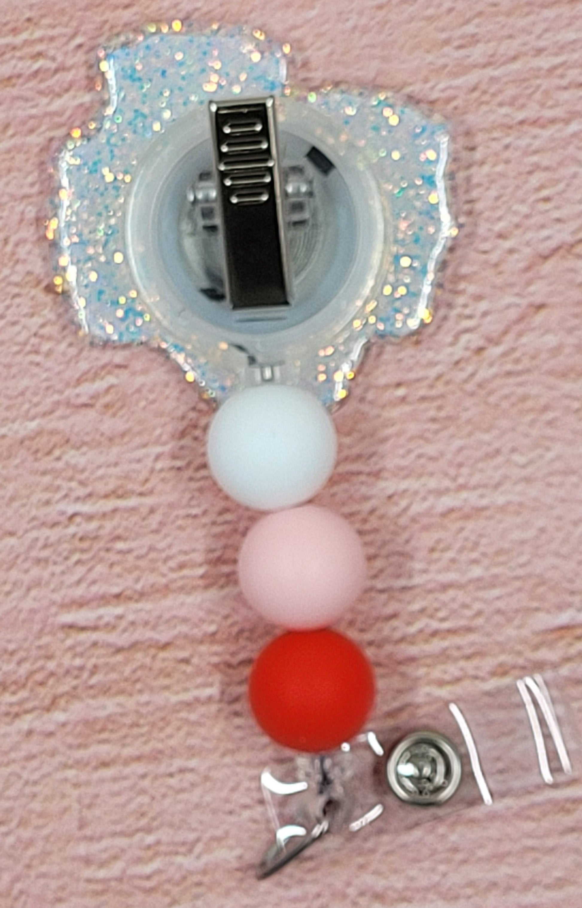 For all those in the medical field that what to show their residents who their Valentine is... we give you the My Residents Are My Valentines Badge Reel. This heart shape badge reel with band aids, pill bottle and a retro nurses hat on a clear glitter base is a definite eye catcher. 3 color coordinated silicone beads finish the look.
