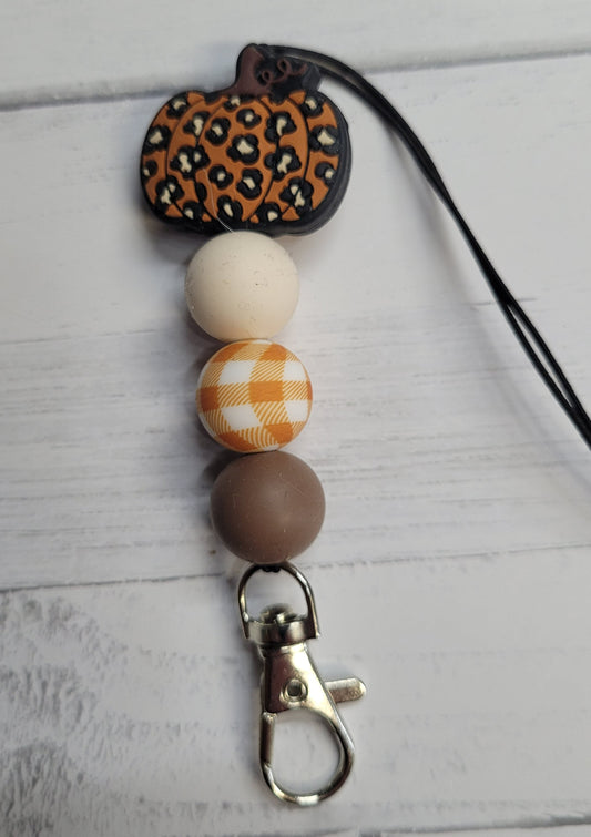 Need a custom Freshie Hanger? Here is a silicone beaded hanger we like to call Leopard Pumpkin. All silicone bead construction with a sturdy clip to hang your Freshie from. Features a pumpkin with leopard print main bead and color coordinating beads to finish it off. Attaches quickly to any one of our many Freshies so you can easily hang it from your rear view mirror.