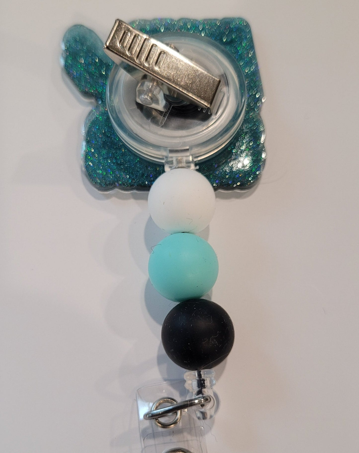 AMA   Say Less  Those who know...know. Just say less. This new addition to our Medical Field collection is a must have.  Light Blue glitter base with color matching beads finish the look.