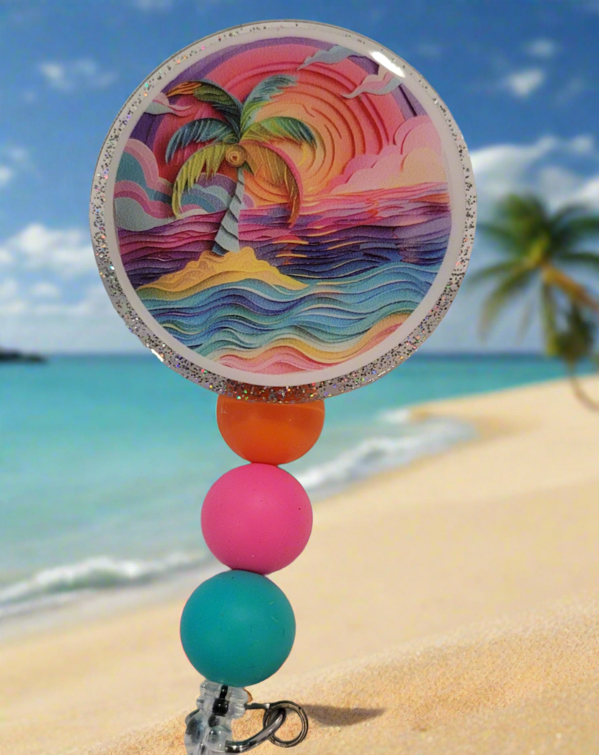 This acrylic badge features a unique, abstract design inspired by a deserted tropical island. It showcases a full range of vibrant, rainbow-like colors and is accented with a glitter back and three silicone beads in coordinating hues. It's sure to catch the eye.