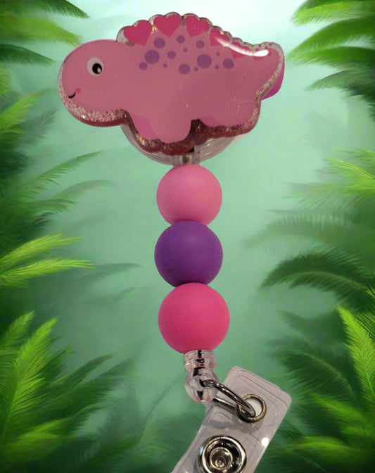 Take you back to the time of the Dinosaurs.... here we have a happy cute little pink Stegosaurus. With a pink glitter back and 3 silicone matching beads, this lil guy will romp and stomp his way into your heart.