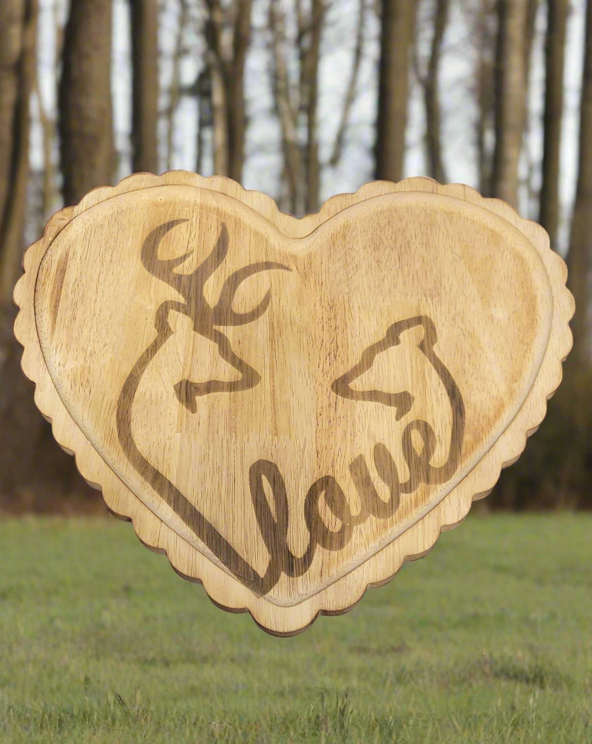 New to our lineup. This is a Heart Shaped Tray with the outline of a Buck &amp; Doe linked with the word Love. Engraved on bamboo wood measuring 11" x 13" this beaty can be used as a wall hanging or a tray in any room.