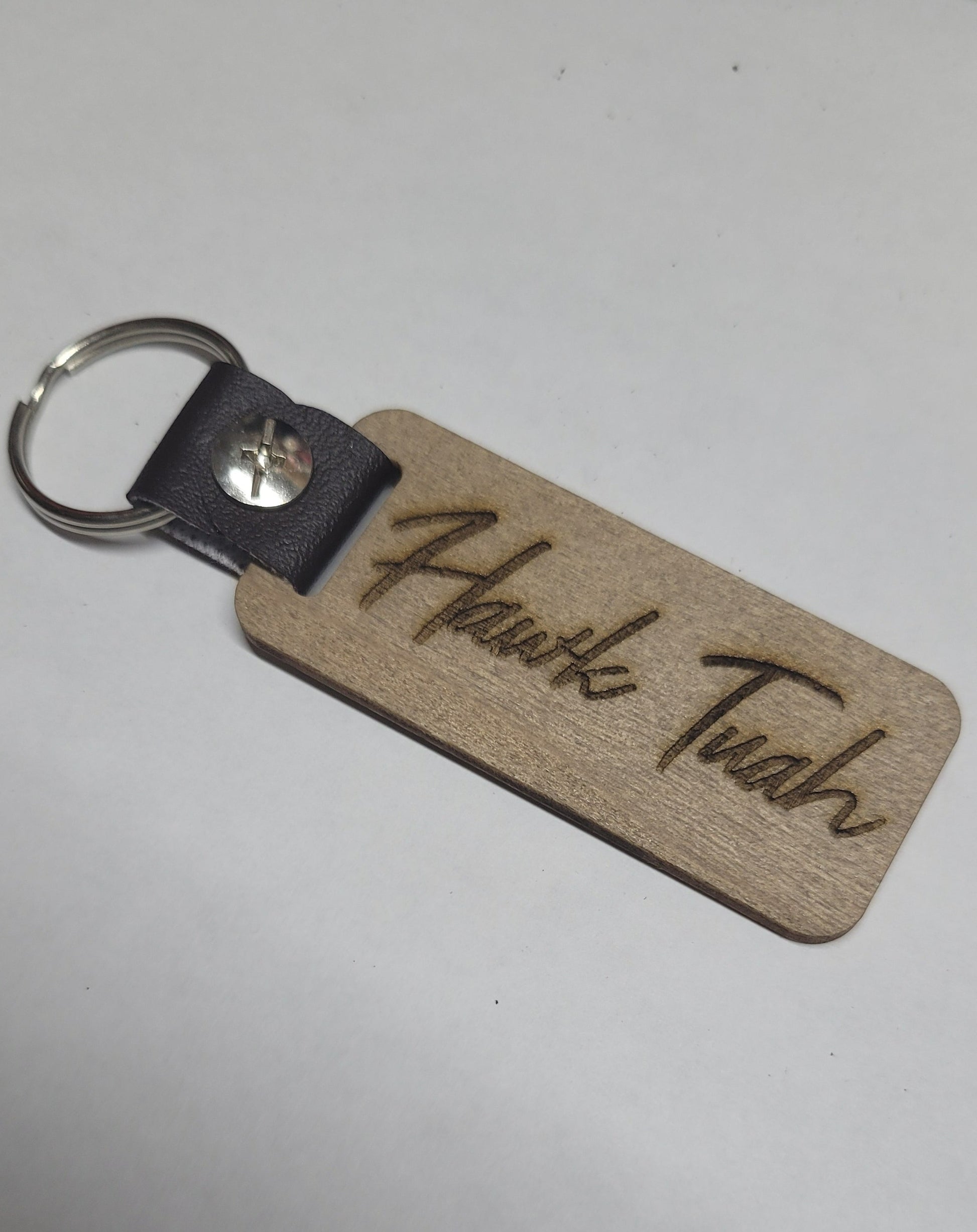 This Laser Engraved wood key chain sports the latest phrase.... Hawk Tuah.  This on the front and Spit on That Thang on the back.  For a fun novelty gift.... a must have