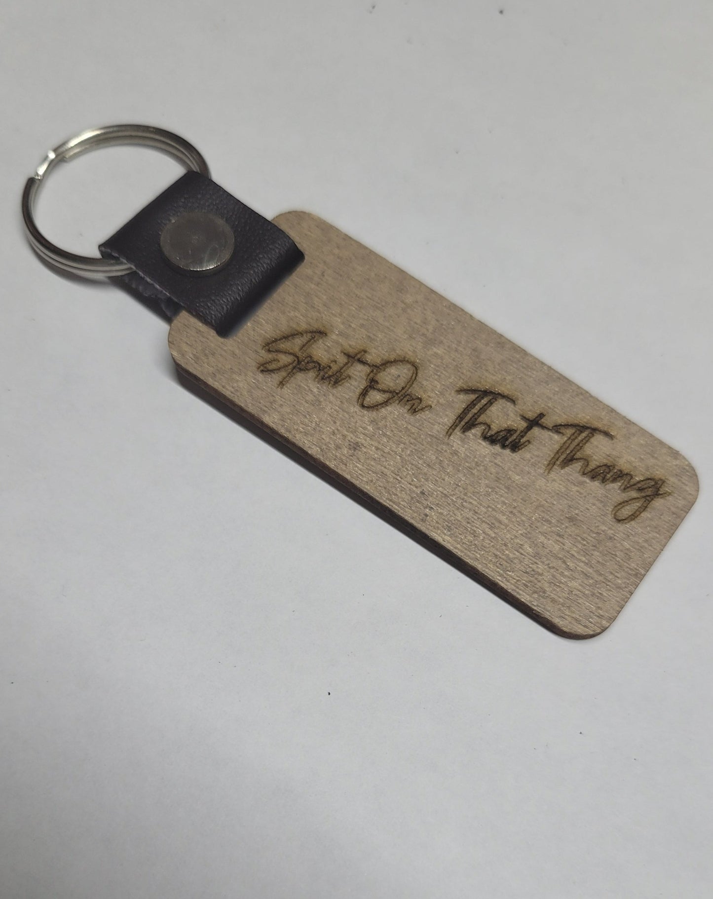 This Laser Engraved wood key chain sports the latest phrase.... Hawk Tuah.  This on the front and Spit on That Thang on the back.  For a fun novelty gift.... a must have