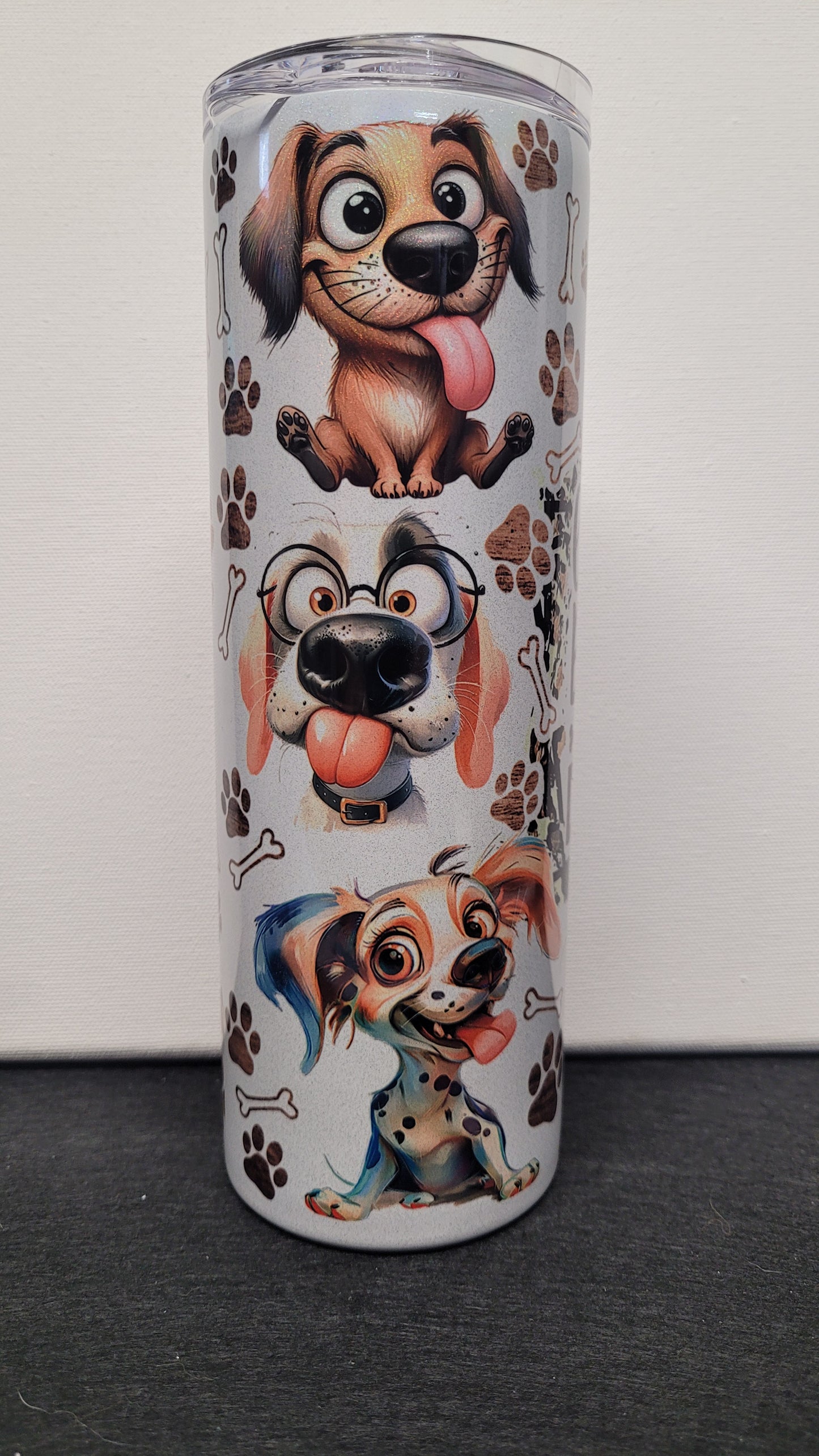 Life Is Better With Dogs. It just is. This comical and cute dog theme really pops on our holographic 20 oz tumbler. Enjoy your favorite hot or cold beverage on the go and show off your style as you keep your drinks at the perfect temperature.