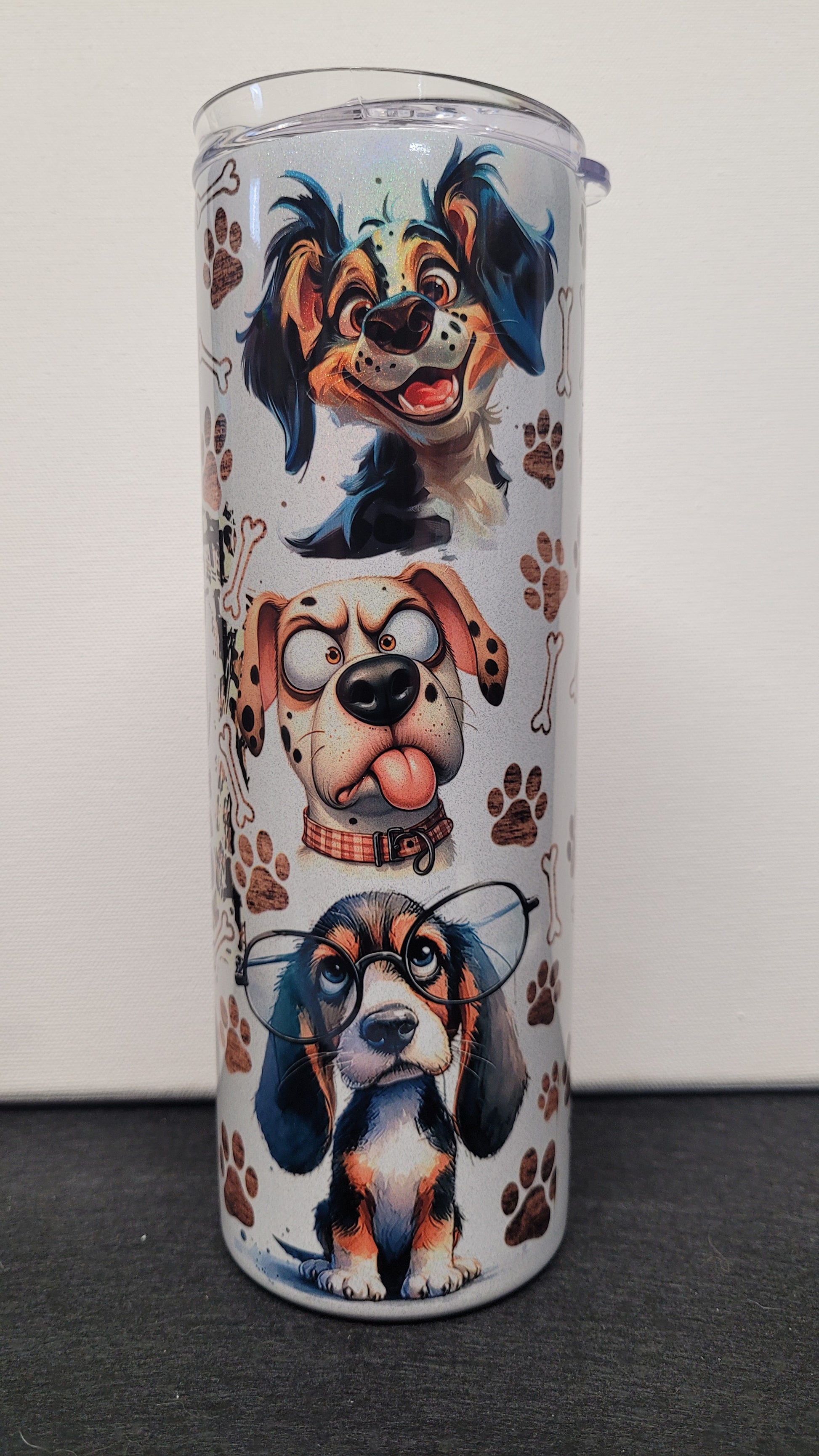 Life Is Better With Dogs. It just is. This comical and cute dog theme really pops on our holographic 20 oz tumbler. Enjoy your favorite hot or cold beverage on the go and show off your style as you keep your drinks at the perfect temperature.