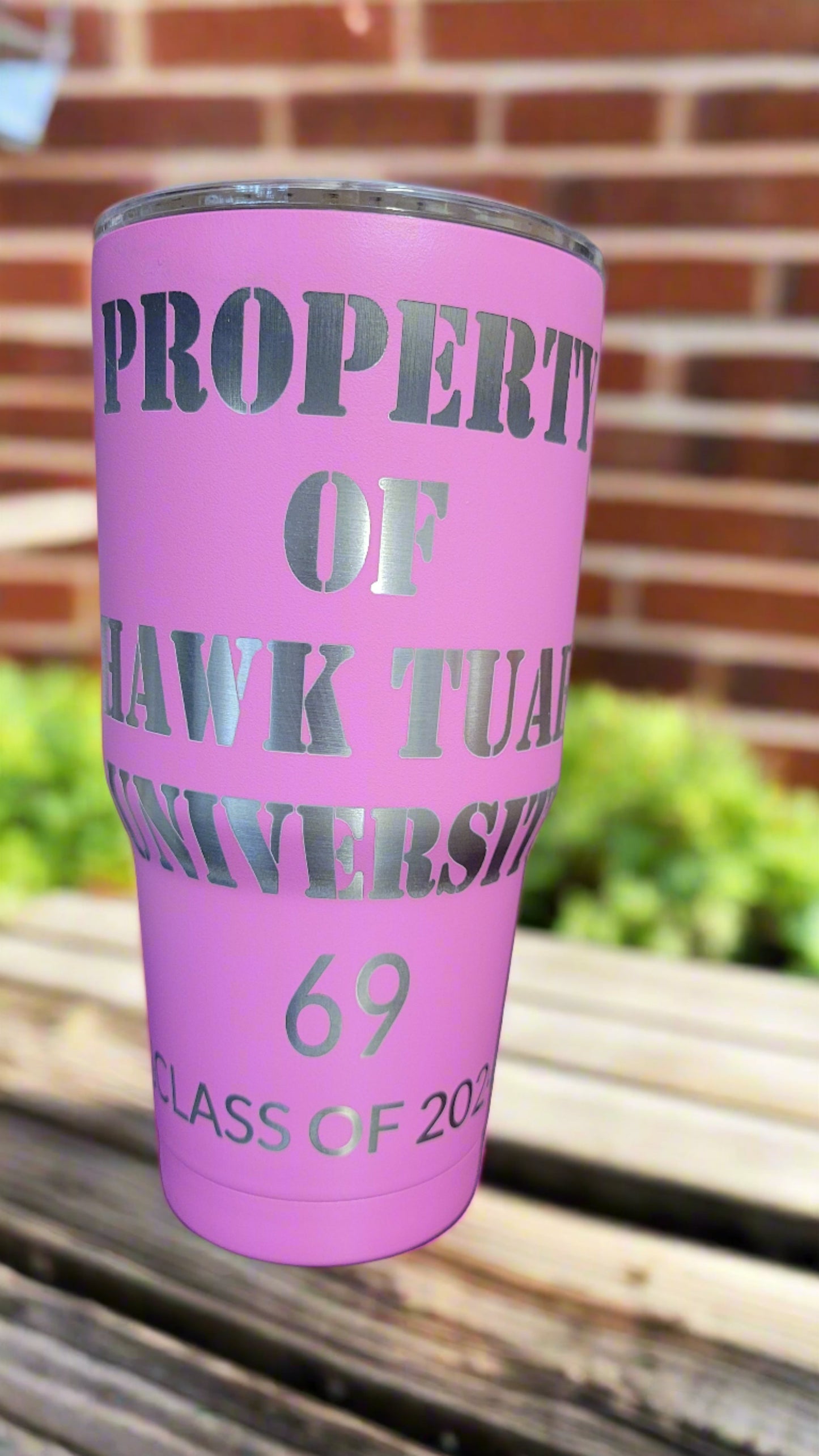 Property of Hawk Tuah University pink laser engraved tumbler. This is a full engraved tumbler featuring the Property Of Hawk Tuah University as well as Alpha Beta Spitta sorority on the other side. This Makerflo 30 Oz Stainless Steel Powder Coated Tumbler is precision laser engraved and will keep your cold drinks cold or hot ones hot for long periods of time.