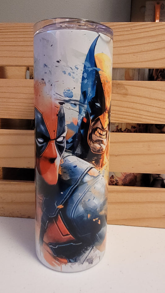 Deadpool &amp; Wolverine...together finally! Here is a watercolor image of the pair. This 20 oz tumbler from Makerflo is made of a stainless steel double-wall construction and is vacuum insulated, with a clear sliding classic lid and a clear straw, and is BPA free. It is capable of retaining cold temperatures for 24+ hours or warm temperatures for up to 8 hours.