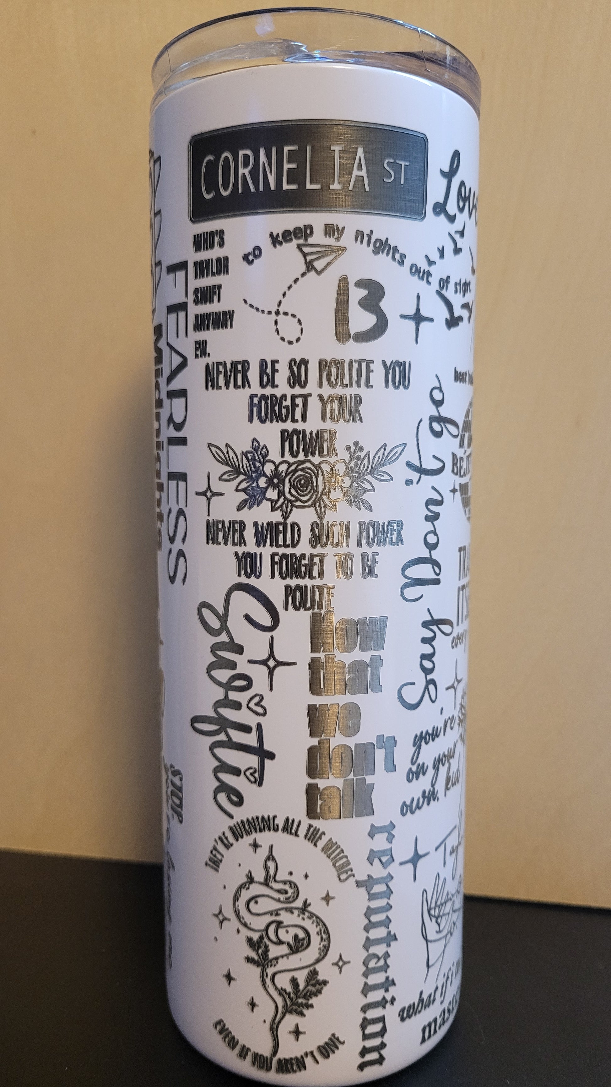 Introducing our awesome laser engraved tumbler for the Swifties! This tumbler features a full wrap design, with a snow white base&nbsp; color and precision laser engraving from top to bottom. It also includes a matching silicone straw for sipping in style. Plus, its stainless steel and powder coated construction ensures excellent insulation for both hot and cold drinks. What more could a Swiftie ask for?