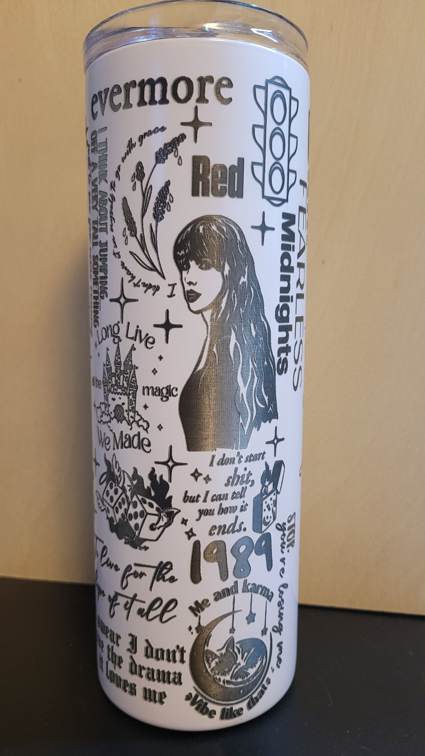 Introducing our awesome laser engraved tumbler for the Swifties! This tumbler features a full wrap design, with a snow white base&nbsp; color and precision laser engraving from top to bottom. It also includes a matching silicone straw for sipping in style. Plus, its stainless steel and powder coated construction ensures excellent insulation for both hot and cold drinks. What more could a Swiftie ask for?