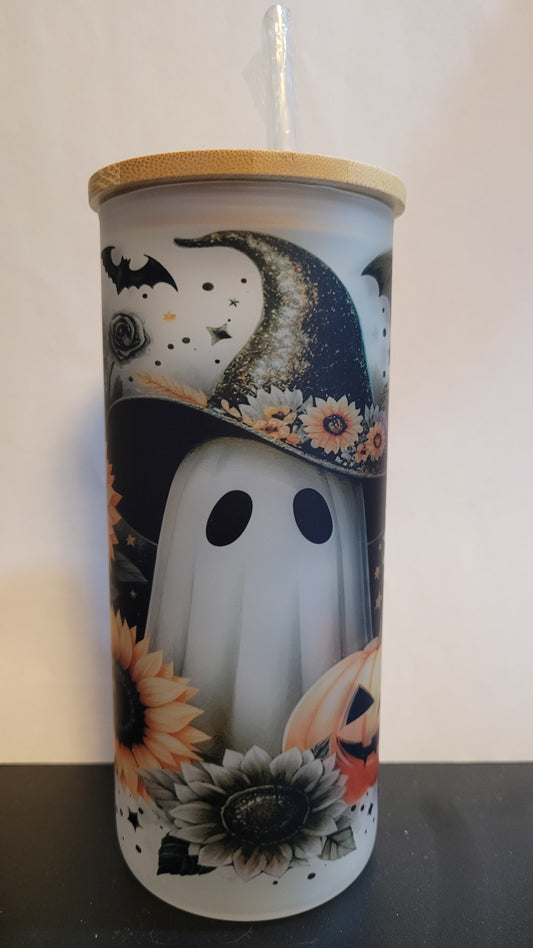 Not all ghosts are scary. Take this adorable Sunflower Ghost wearing a witch hat with a bat overhead and a carved pumpkin in the foreground. This image is sublimated onto a glass can tumbler and comes with a straw and bamboo lid.