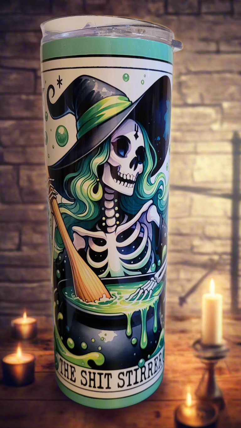 The Shit Stirrer...Stirring the pot as a member of the Wicked Witch Club. This sexy witch skeleton is stirring up a cauldron of trouble. This Makerflo 20 oz tumbler is crafted from premium stainless steel and features a sweat-resistant design to keep your drinks chilled for hours. Enjoy the benefits of double-wall insulation, a clear sliding lid, a clear straw, and BPA-free materials. Keep your drinks icy for more than 24 hours or warm for up to 8 hours.