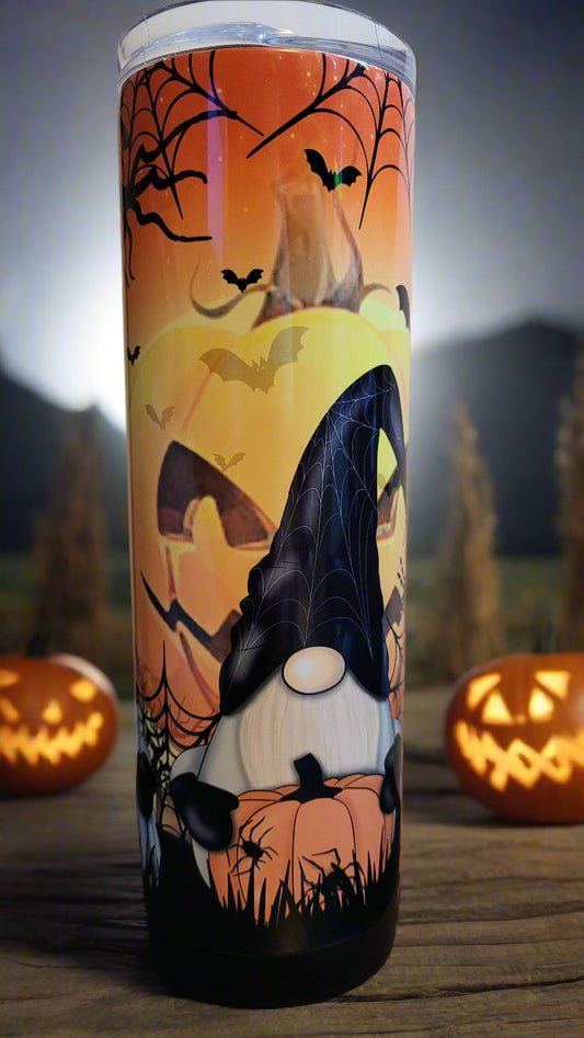 Conquer the pumpkin patch with 3 fearless gnomes and a formidable giant jack o lantern lurking behind them! Defy the odds and embrace the thrill with every sip. This is a stainless tumbler that mirrors our glass can tumbler version. This 20 oz Tumbler from Makerflo is double walled from stainless with great insulating properties.