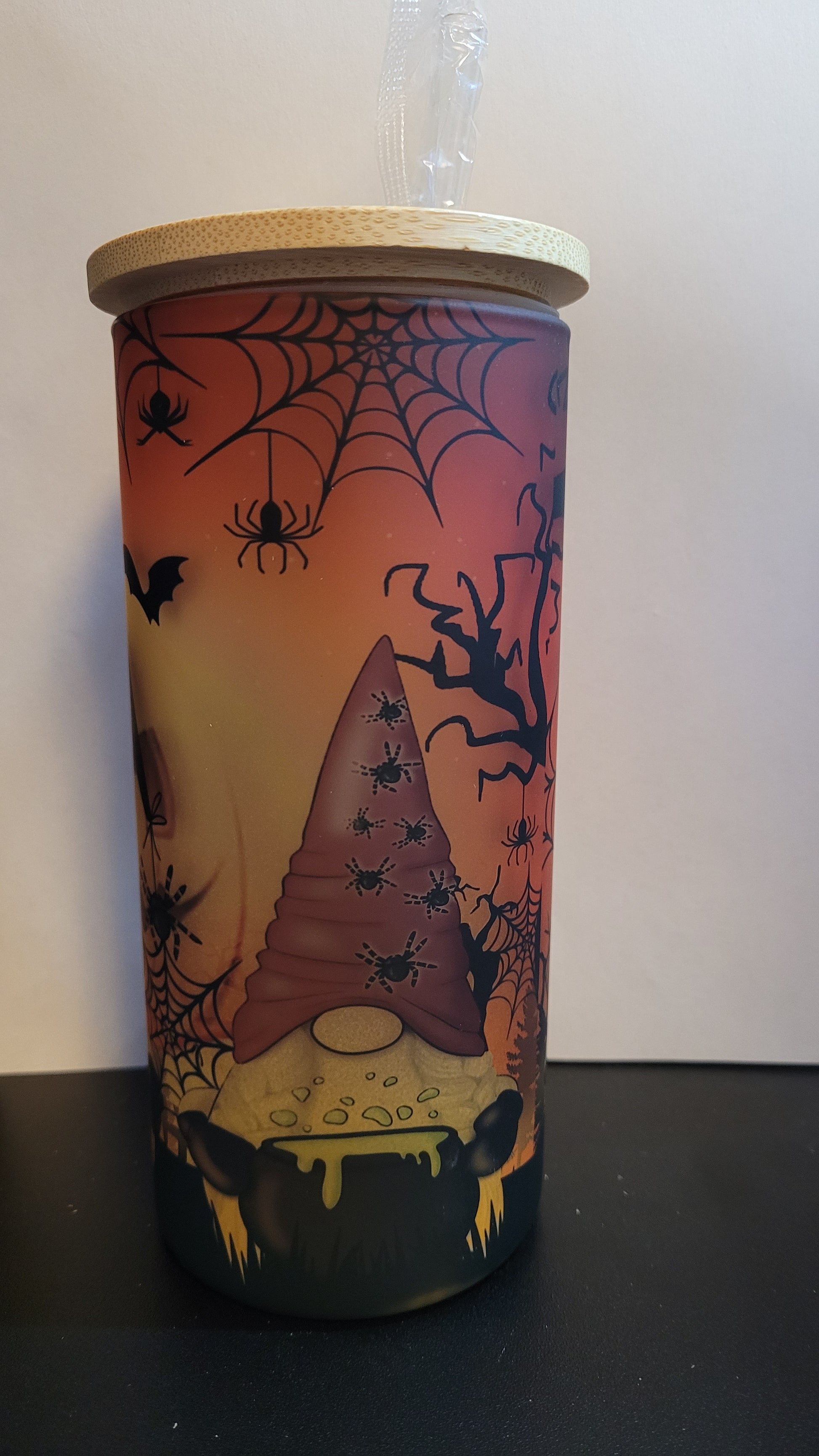 Conquer the pumpkin patch with 3 fearless gnomes and a formidable giant jack o lantern lurking behind them! This dynamic scene is sublimated onto a sturdy glass tumbler, complete with a straw and a bamboo lid. Defy the odds and embrace the thrill with every sip.