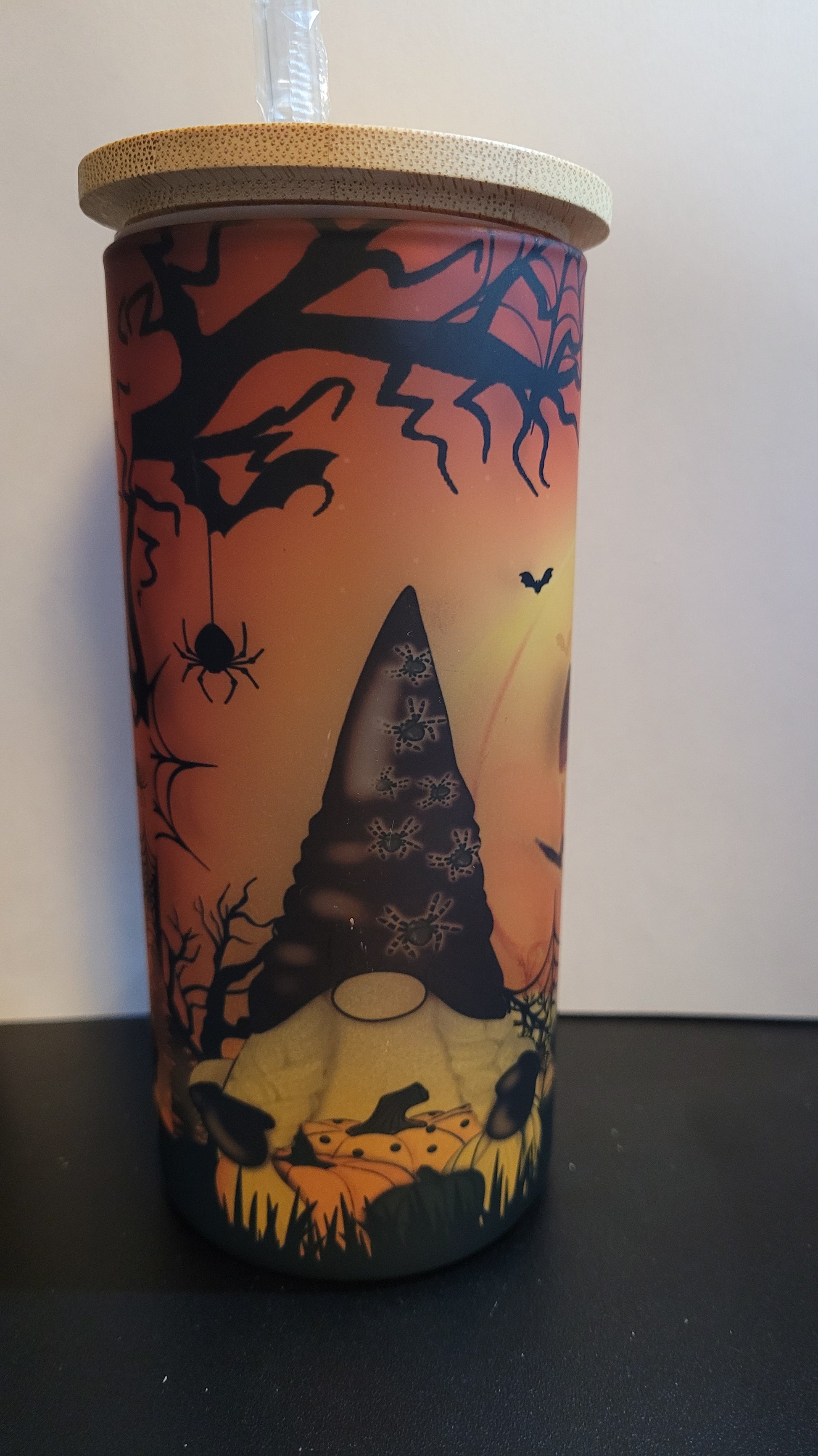 Conquer the pumpkin patch with 3 fearless gnomes and a formidable giant jack o lantern lurking behind them! This dynamic scene is sublimated onto a sturdy glass tumbler, complete with a straw and a bamboo lid. Defy the odds and embrace the thrill with every sip.