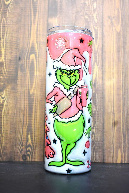 Our old friend the Grinch here in a pink coat and Christmas stocking hat. Is the smirk on his face from the drink he has in his hand or thoughts of how to steal Christmas. This unique 3-D printed design on a holographic tumble is a definite an eye catcher.