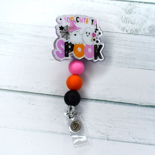 This high-quality acrylic badge reel features 2 spook-proof cute ghosts and includes pink, orange, and black silicone beads to match the Halloween aesthetic.