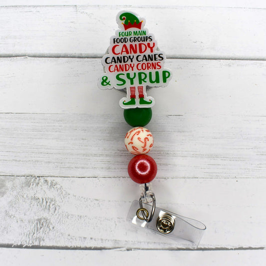 Christmas Time has 4 main food groups. Candy - Candy Canes - Candy Corn- Syrup!  So eat healthy and flaunt it with this badge reel that has glitter back ground finished with a candy cane focal bead and 2 silicone color coordinated beads.