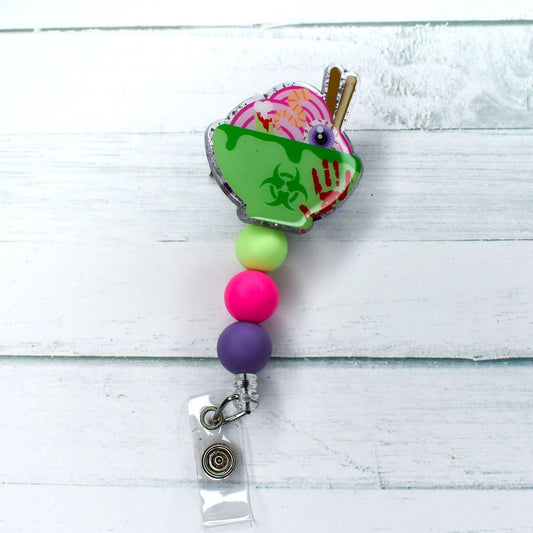 Tonight's special is Toxic Noodles! This acrylic badge reel  features a green bowl full of toxic noodles. Green pink & a purple silicone bead finish this course. Leave room for dessert!