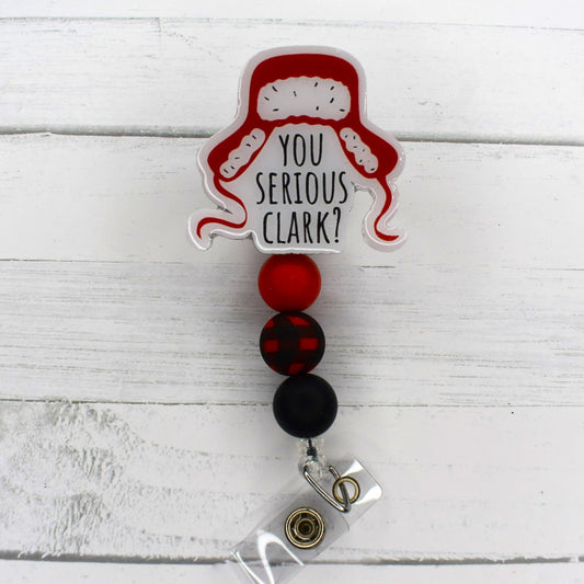 You Serious Clark? So when someone says or asks you something so ridiculous, flash your badge reel. A Buffalo plaid focal bead and 2 color coordinating silicone beads finish the look.