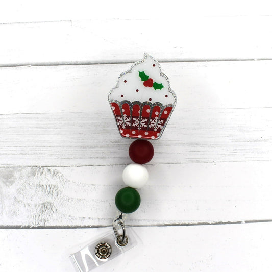 From our Limited Edition Christmas Cupcake Series this is 1 of 5 in the set. It is the Mistletoe Cupcake featuring a glitter base and a cupcake decorated with a white frosting and a sprig of Mistletoe. A red White &amp; Green Silicone bead finish the look. Like any great snack, when it's gone... it's gone!