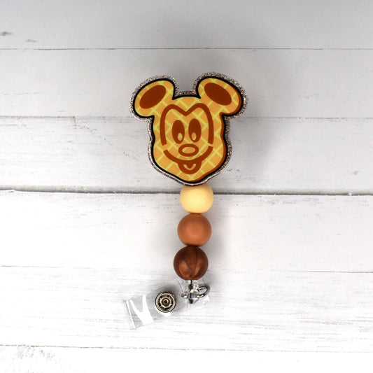 mmmm, can't you smell them...waffles.... with that happy mouse design on them covered in syrup colored silicone beads.... OK, not a breakfast thing here but this badge reel reminds you of that awesome kids breakfast at your local diner. Waffle base with matching colored silicone beads to finish the look.