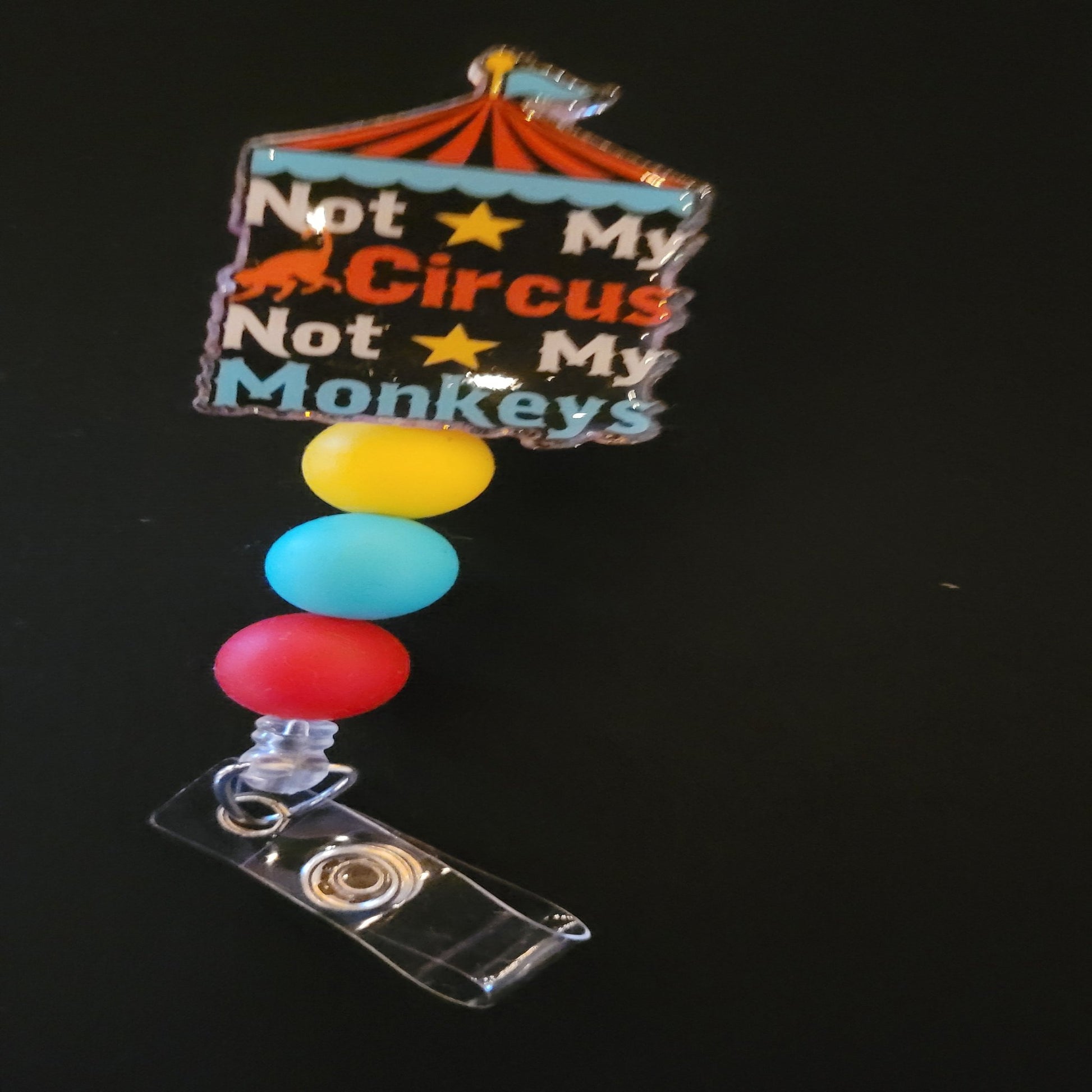 Not My Circus Not My Monkeys! Ever feel like a ring master for someone elses circus? This badge reel has a shiny glitter base and is finished with 3 color coordinated silicone beads.