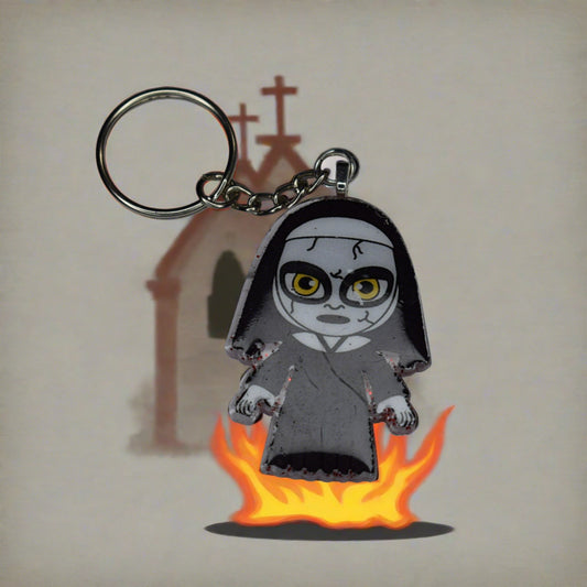 From our Horror Collection here is The Nun. Hey, There is nothing holy with this sister. Blood red glitter back and that scary sister on the front. Hand crafted from acrylic resin, strong and durable. Say your prayers with this keychain.
