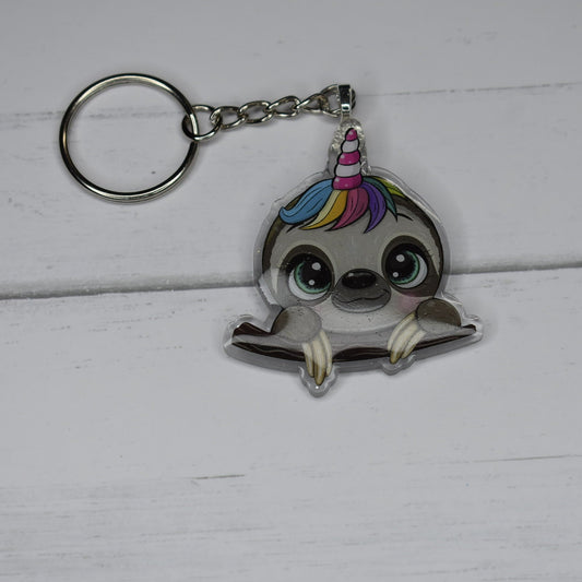 Boasting our unique Sloth signature, the Slothicorn acrylic Keychain is a delightful combination of a Sloth and Unicorn. This mythical creature is sure to excite.