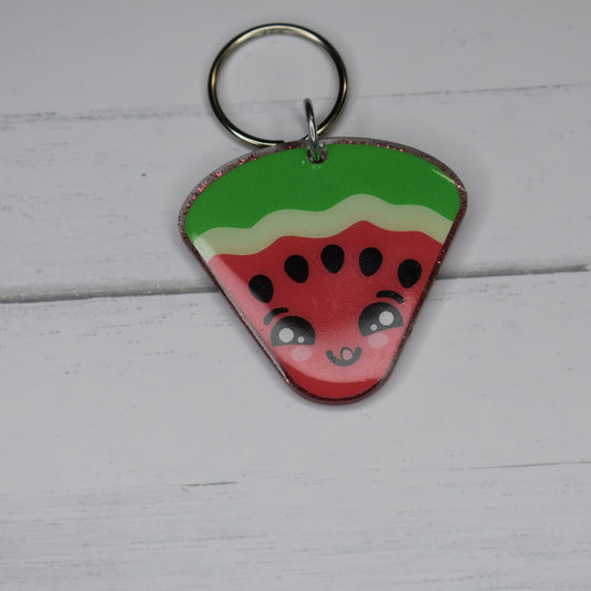This Keychain Watermelon has an acrylic foundation with red glitter and features a delightful smiling watermelon slice on the front. Plus, a resin base adds durability.