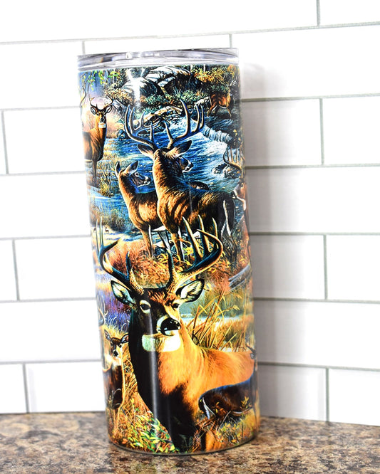 This 20 oz Stainless Steel tumbler feature a Big Whitetail Buck in various scenes that all appear to be tearing through the walls of the tumbler. It is double-walled, vacuum insulated, and features a clear sliding classic lid and clear straw. BPA free, this tumbler retains cold temperatures for 24+ hours and warmth for 8 hours.