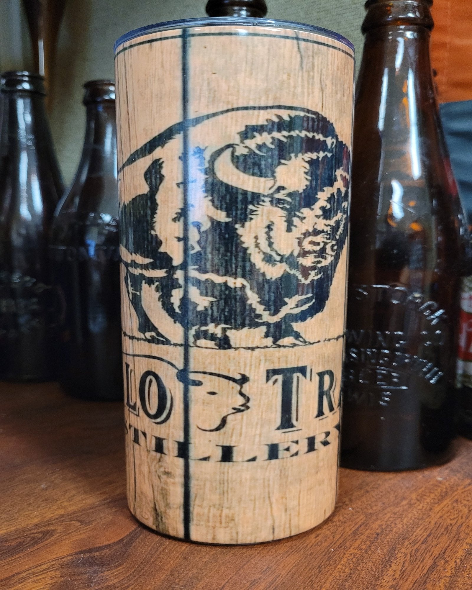 This 20 oz stainless steel tumbler comes straight from Kentucky...Kentucky stills that is. Buffalo Trace... a quality Kentucky Straight Bourbon Whiskey is depicted beautifully here with the classic Buffalo on a wood grain finish.