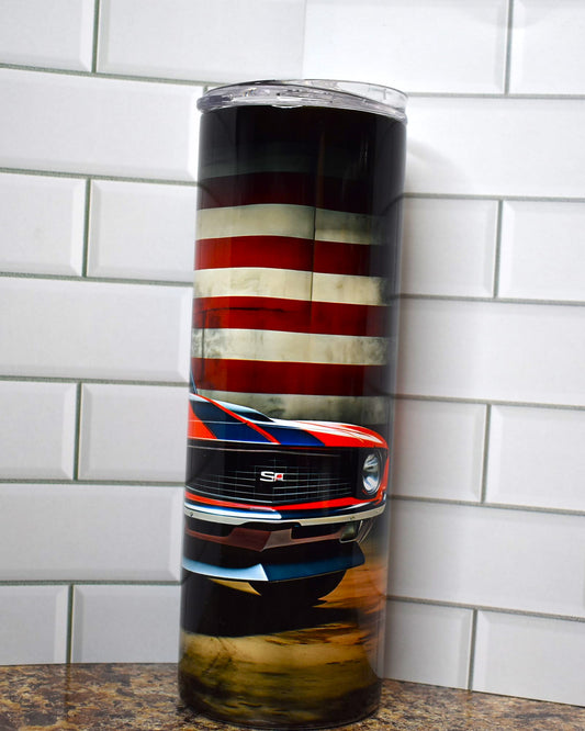 Muscle cars ruled the roads and this tumbler pays homage to the Chevy Camaro in classic red and the 2 black stripes down the hood with the American Flag in the background.