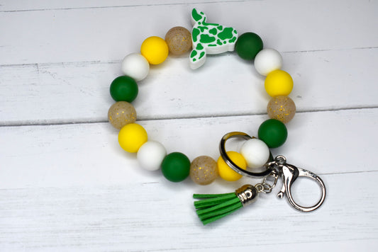 From our cow collection we have this Wristlet keychain made from silicone beads with cute green cow with a faux leather tassel.