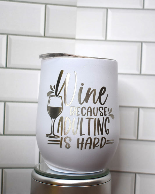 Introducing our 12 oz wine tumbler series!  This one has that classic catch phrase.... Wine Because Adulting Is Hard. If this tumbler doesn't put a smile on your face we are sure the wine will. Cheers.