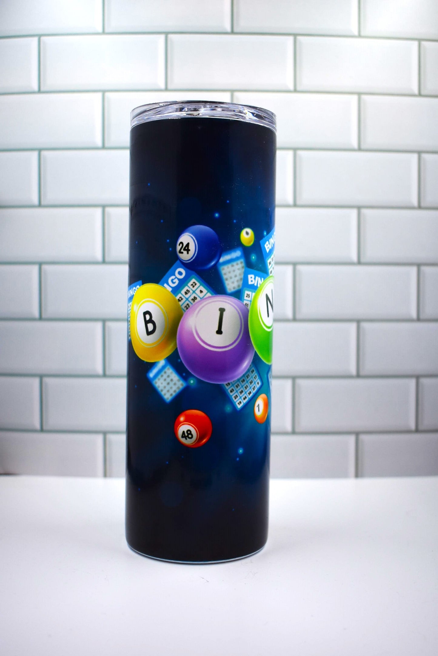 Boasting a 20 oz capacity and made from stainless steel and vacuumed insulated material, this Makerflo tumbler features the classic BINGO! image along with the iconic numbered ping pong balls. 
