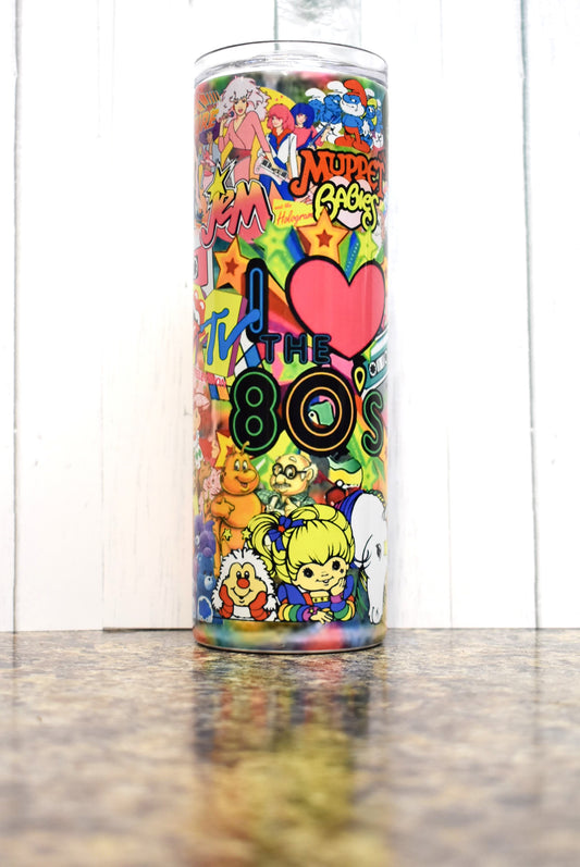 Turn back the clock to the 80s with this 20 oz tumbler. A stroll down memory lane as you pick out the many different iconic things from that decade. Sure to put a smile on your face. 