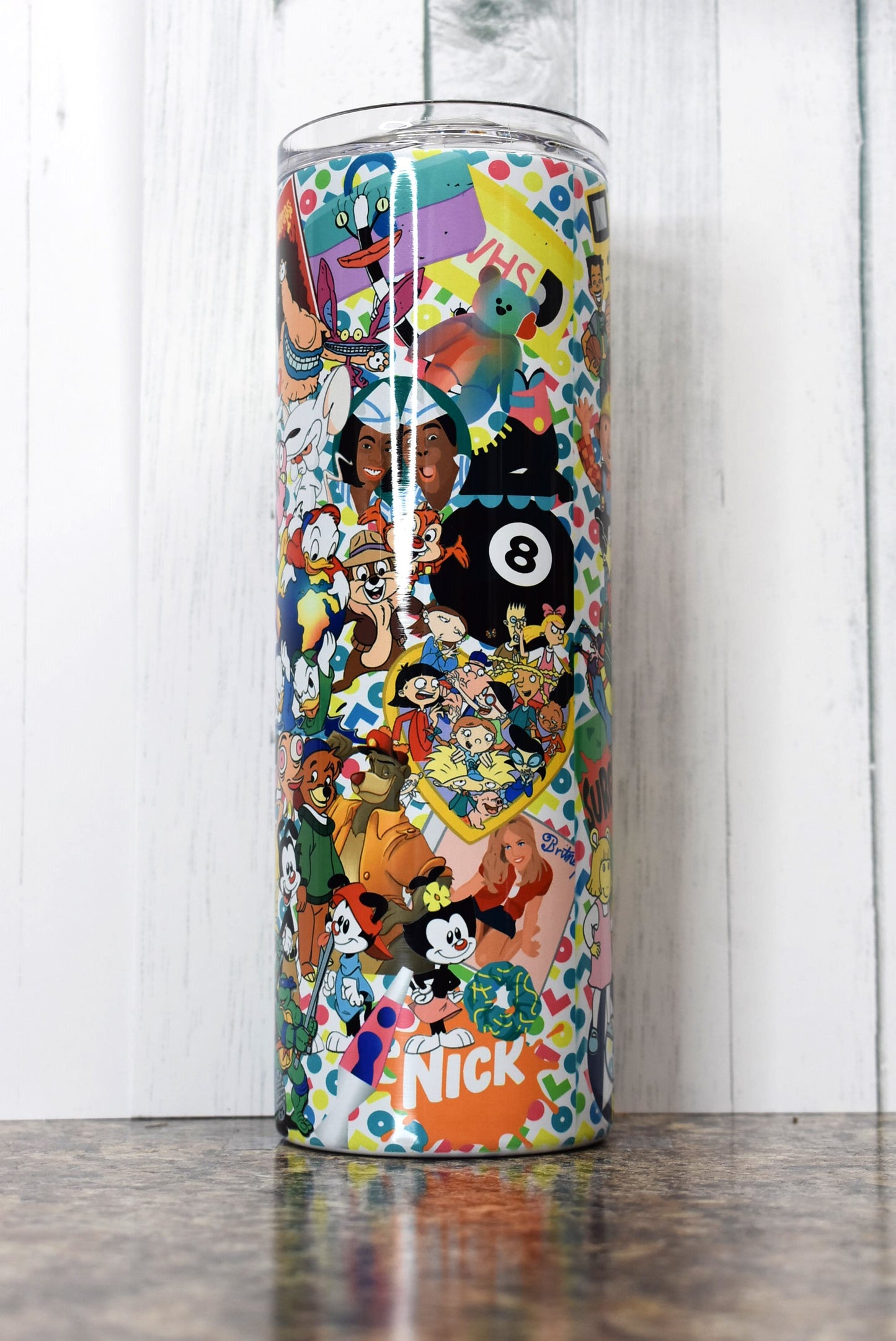 Turn back the clock to the 90s with this 20 oz tumbler. A stroll down memory lane as you pick out the many different iconic things from that decade. Sure to put a smile on your face.