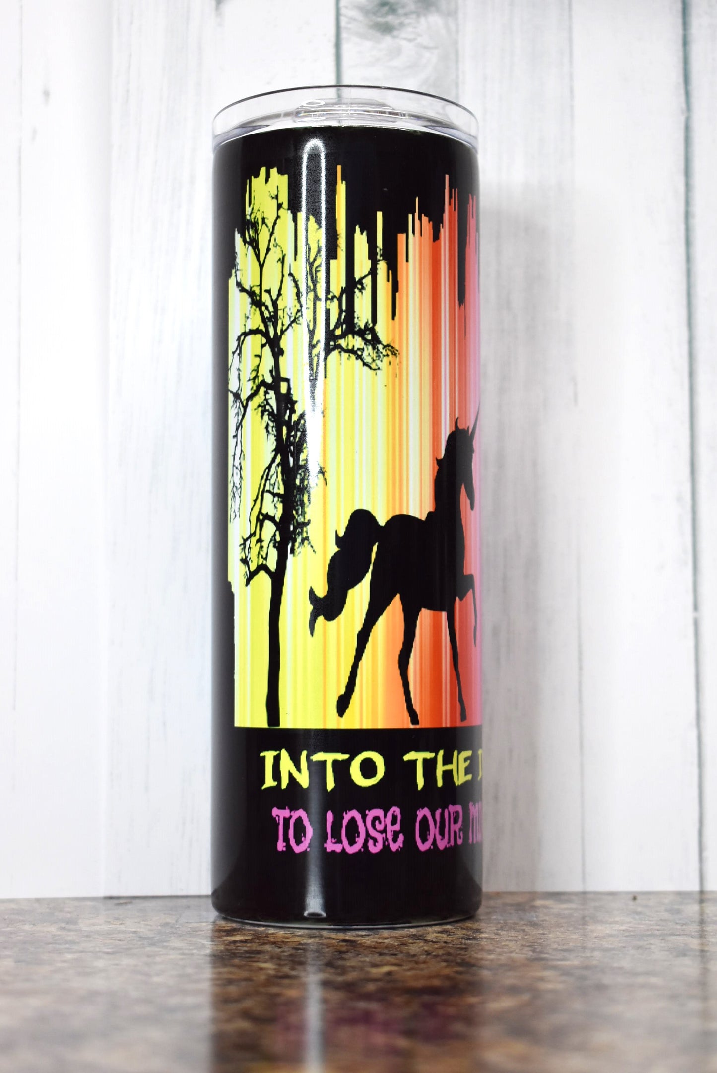 Into The Darkness We Go To Lose Our Minds & Find Our Souls. This colorful 20 oz tumbler depicts an alien, Unicorn and Bigfoot....I want to Believe... 