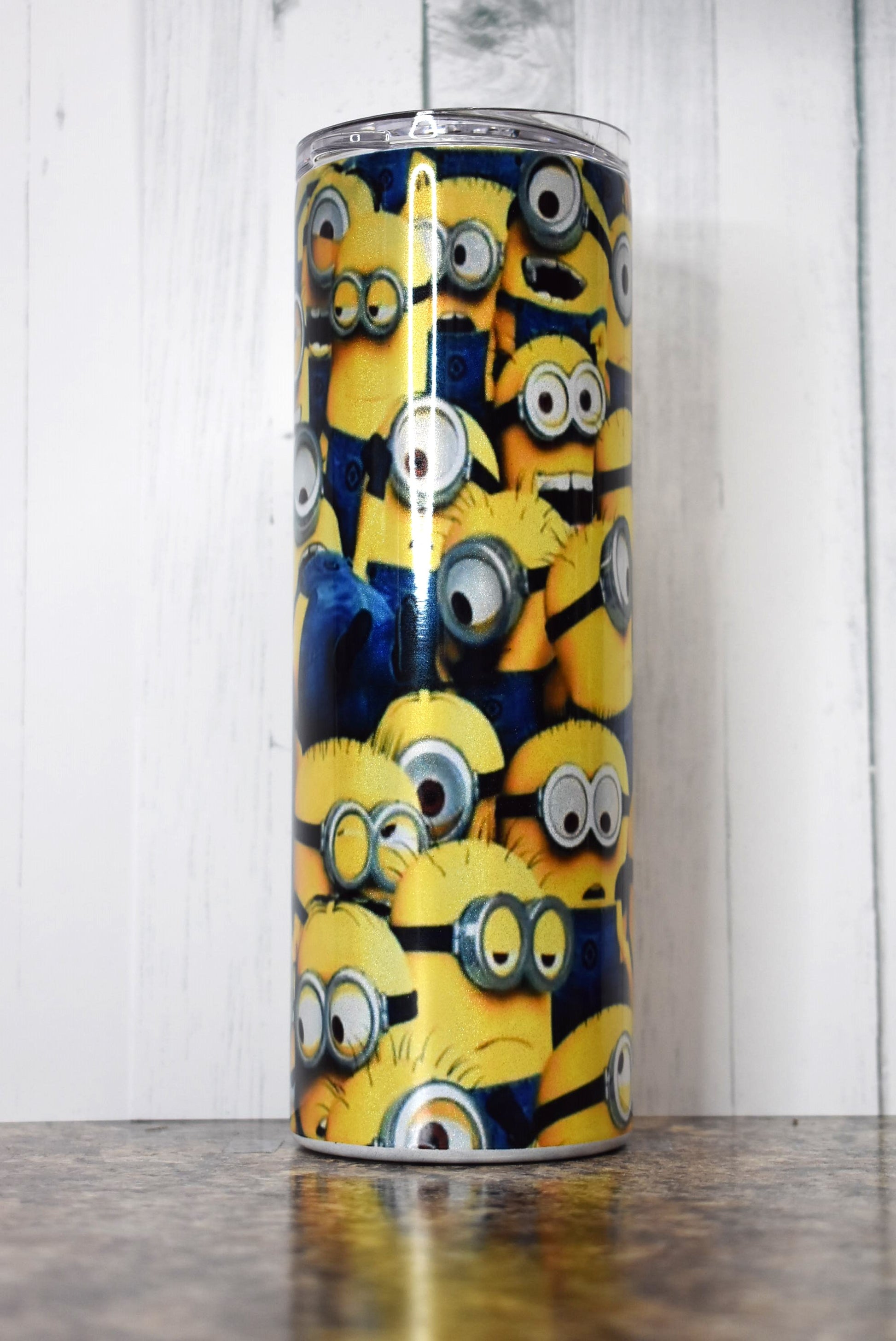 The Gangs all Here with this funny Minions 20 oz tumbler showing all sorts of these lovable characters.