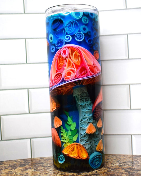 This tumbler is for the Fungi. All sorts of mushrooms in 3D adorn this tumbler on a blue background.