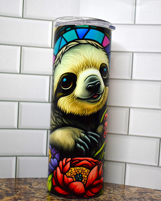 This adorable sloth is front & center here with a stained glass background and a bed of flowers up front. This 20 oz Tumbler from Makerflo is double walled from stainless with great insulating properties.