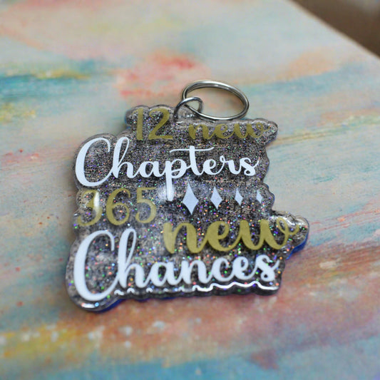 This acrylic keychain is symbolic of the 12 New Chapters and 365 New Chances that life brings, encouraging us to make every day count.