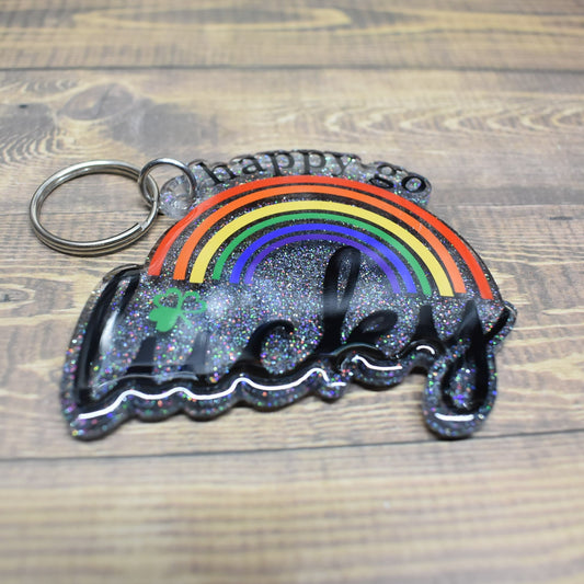 High-Grade Acrylic Resin Keychain Showcasing A 'Happy Go Lucky Under A Rainbow' Design