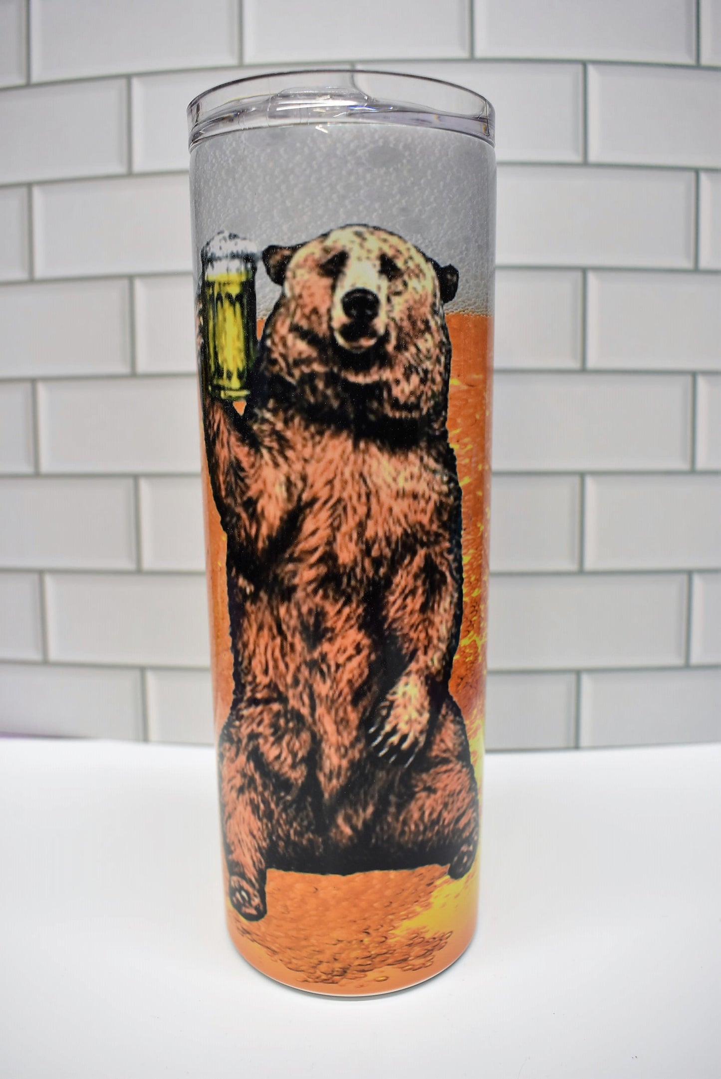 20 oz Stainless Steel tumbler. This Grizzly is always happy to lift a cold one. Cheers!