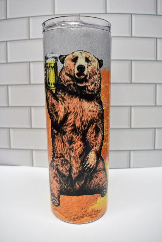 20 oz Stainless Steel tumbler. This Grizzly is always happy to lift a cold one. Cheers!