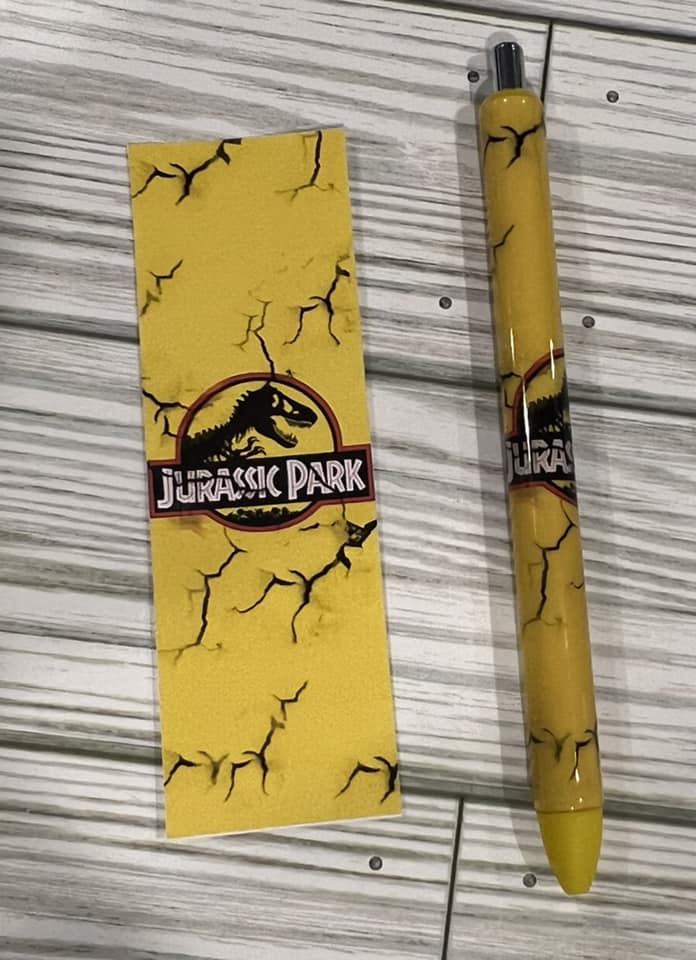 This Gel Pen features an Epoxy Resin coating and a T-Rex image, and comes with yellow ink and one black ink extra refill.